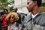 Diddy's mother and one of his sons outside the courthouse during his trial (Image via Getty)